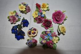 A small selection of ceramic and resin floral brooches