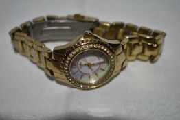 A lady's quartz wrist watch by Guess having baton numeral dial to mother of pearl face with diamante