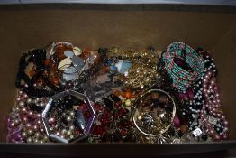 A selection of costume jewellery including strings of beads, bracelets, etc