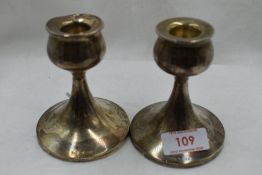 A pair of squat rose bud styled candle stems HM silver stamped W A