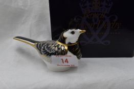 A Royal Crown Derby Pied Wagtail paperweight, boxed with gold stopper