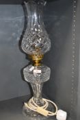 A Waterford crystal table lamp in the form of an oil lamp.