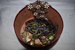 A small selection of costume jewellery including glass and enamel necklaces