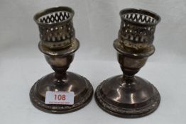A pair of squat American candle sticks by La Pierre also stamped Sterling