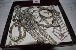 A small selection of diamante costume jwellery including tie shaped necklace, bracelets etc