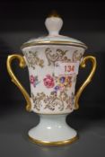 A lidded Porzellanfabrik Martinroda Dresden china lidded urn with floral pattern with hand tinted