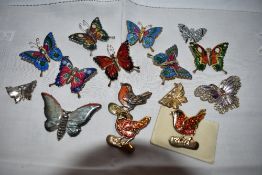 A small selection of bird and butterfly brooches