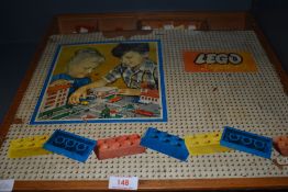 A selection of vintage toy Lego bricks and similar in hand made case