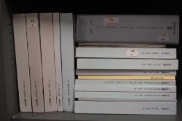 A collection of Lladro bound catalogues and books.