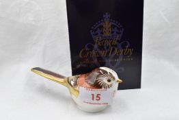 A Royal Crown Derby Longtail Tit paperweight, boxed with gold stopper