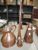 A selection of copper wares including half gallon and post horn