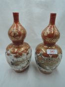 A pair of antique export mirrored double gourd vase possibly Japanese extensively decorated with