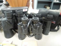 A selection of binoculars including Helios 7x50 Regent 8x40 and similar all with cases