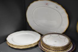A selection of dinner wares including Copelands blue and gilt scalloped plates and similar Cauldon