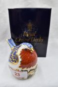 A Royal Crown Derby Robin nesting paperweight, boxed with gold stopper