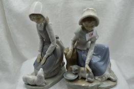 Two ceramic figure studies by Nao of girl with lamb and girl with kitten