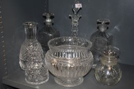 A collection of glass including cut glass decanters.