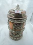 A large copper Japanese container having white metal decoration with Dragon imagery possibly for tea