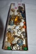 A small selection of costume jewellery including clip back earrings, pendants, enamelled cross,