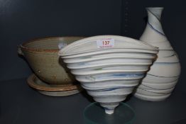 A selection of studio pottery with white and glue green grounds