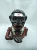 A heavy cast mechanical money bank