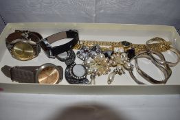 A small selection of costume jewellery and wrist watches including clip earrings by Ermani