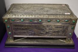 A 1930s table top casket having individual pewter panels, and green hard stone decorative detailing