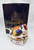 A Royal Crown Derby Gold Finch nesting paperweight, boxed with gold stopper