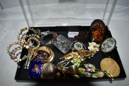 A small selection of costume brooches including shamrock, diamante etc