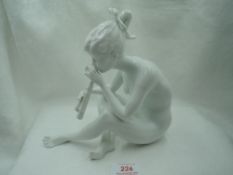 A modern ceramic figure study by Kaiser of girl sitting playing flute