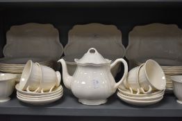 A part tea and dinner service by Wedgwood having cream glaze and black back stamp