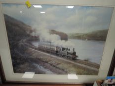 A framed and mounted print depicting steam train on coastal voyage after Dan Breckon.