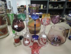 A selection of colour art glass including cut and etched glasses