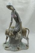 A ceramic figure study by Nao of Girl feeding Calf