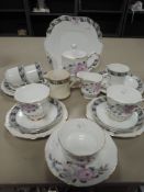 A selection of tea cups and saucers including hand decorated