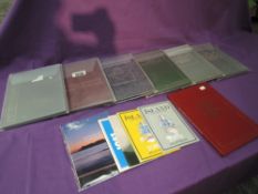 Seven Australian Year Books along with Iceland and Gibraltar Stamp Packs