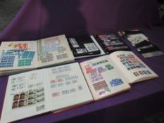 A Collection of GB Stamps in six albums and loose, mainly mint Queen Elizabeth II