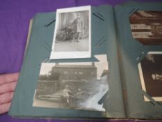 A Vintage Postcard Album containing many early Military Real Black & White cards