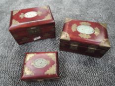 A selection of oriental jewellery cases having carved Jade style panels to top