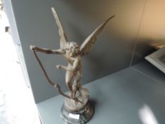 A Victorian French spelter figure of an angel stringing bow on marble base