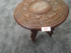 A small hand carved Indian table