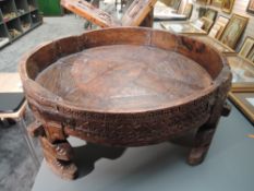 A traditional hand carved and wrought iron Indian Chakki table having good signs of age