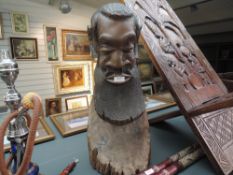 A large standing heavy ethnic wood carved African head possibly Zulu 66cm tall