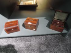 A selection of early 20th century tea caddies including rosewood cases and inlayed labels