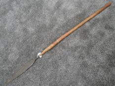 A small tribal spear having wood shaft with wrought iron tip measuring 104 cm long possibly from the
