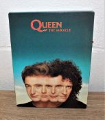 A rare promo pack for 'The miracle' includes booklet,photo,compact disc and cassette tape.