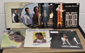 Seven Freddie Mercury and related vinyl records.