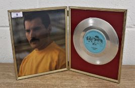 'A kind of magic' framed disc and Freddie photo.