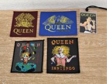 Four embroidered badges/patches.