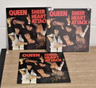 Three copies of sheer heart attack vinyl albums.